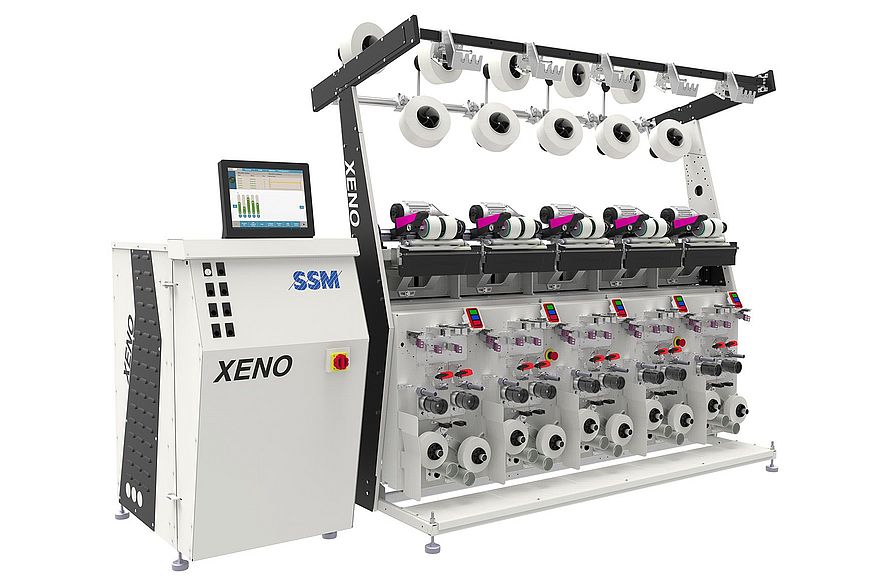 XENO-AC TWIN air covering machine making elastic dual core yarns with adjustable settings for smooth and stable intermingling.