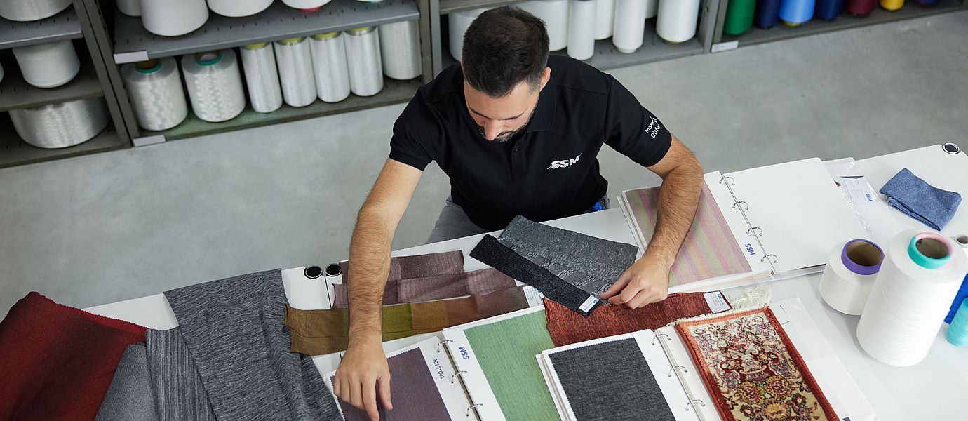 SSM textile technologist assessing yarn to provide quality recommendations to customers.